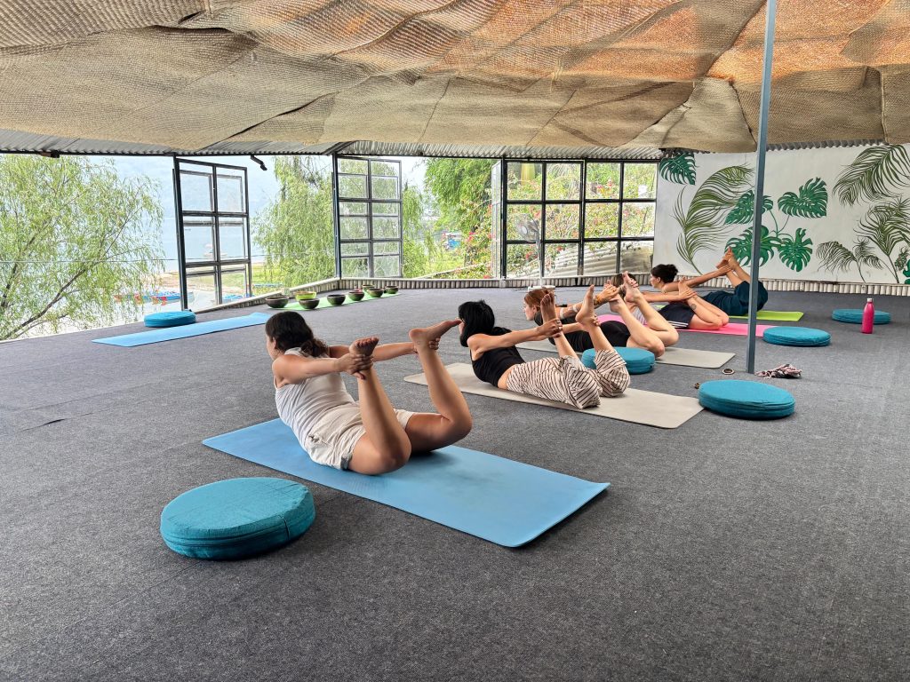 Group practicing traditional Hatha Yoga at Unmani Yoga Retreat in Pokhara, Nepal
