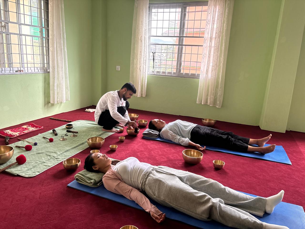 Yogi Sudhan leading a Himalayan singing bowl sound healing session at Stillness Sound Healing Pokhara
